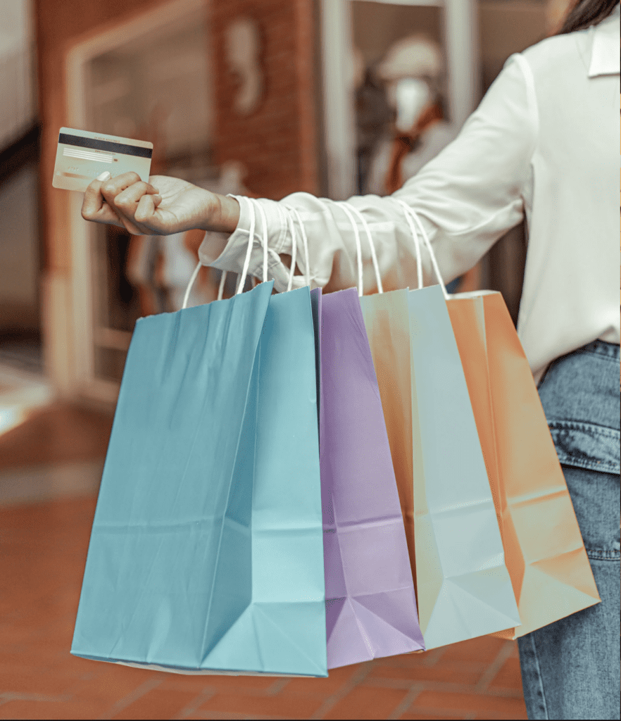 An image showing shopping bags and a credit card.