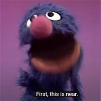 Grover muppet close to represent "near" column in chart